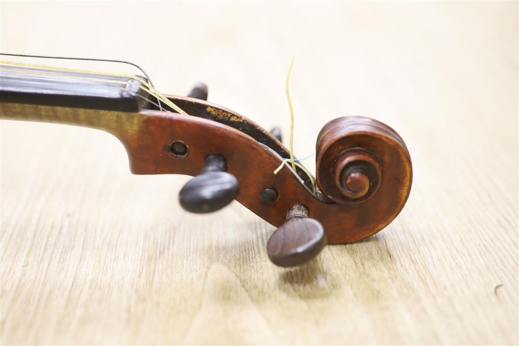 A late 19th century violin and a bow, cased